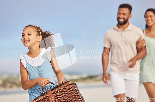 Image of Happy family, parents or kid walking for beach picnic to relax on fun summer holiday vacation together. Excited dad and mother or excited young girl bonding, smiling or holding basket at seashore