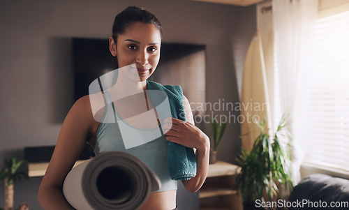 Image of Yoga, portrait and Indian woman with a mat for fitness, training and workout in her home. Face, smile and female person in a living room for holistic, balance and calm, mental health and exercise