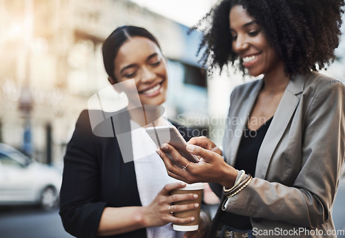 Image of Happy business people, friends and phone in city for social media, communication or texting on street sidewalk. Woman employees or colleagues smile on mobile smartphone for networking in a urban town