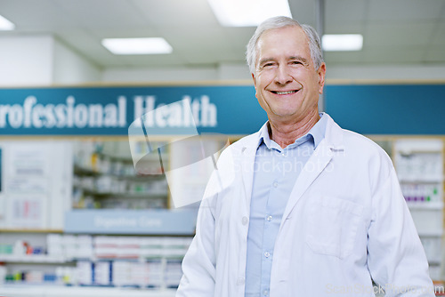 Image of Happy, senior and portrait of man in pharmacy for medical, pills and retail. Medicine. healthcare and trust with face of pharmacist in drug store for product, wellness and expert advice