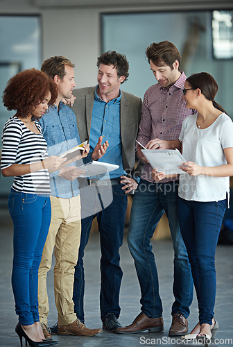 Image of Teamwork, discussion or business people with ideas in meeting for brainstorming as a group in office. Diversity, collaboration or employees networking or planning with notes or documents in workplace