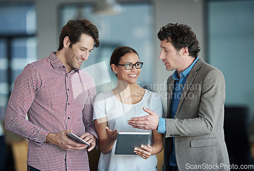 Image of Teamwork, tablet or happy business people with research in meeting for brainstorming together in office. Diversity, collaboration or employees speaking of technology or digital network in workplace