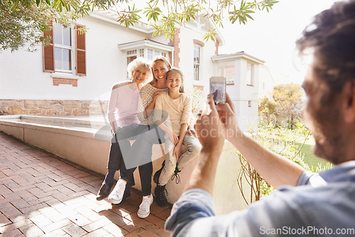 Image of Picture, family and happy grandma, mother and child bonding, smile and father taking outdoor generations photo. Cellphone, support and happiness of young kid, mom and elderly grandma in home backyard