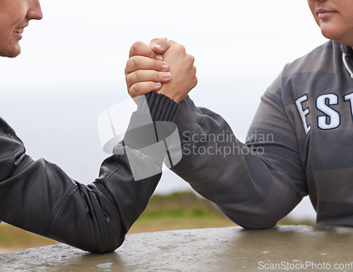 Image of Hands, friends and competition with men and arm wrestling in nature for challenge, power and respect. Team, strong and conflict with closeup of people and holding hands for muscle, match and rival