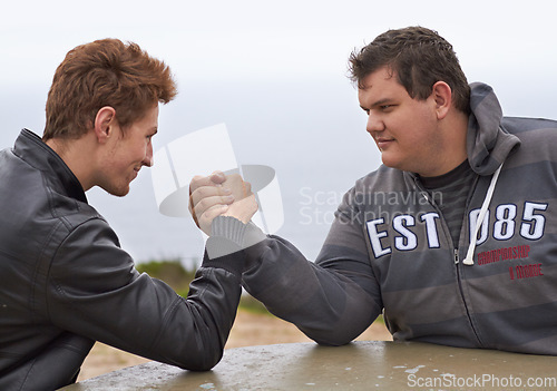 Image of Challenge, friends and competition with men and arm wrestling in nature for sport, power and respect. Team, strong and conflict with people and holding hands for muscle, match and rival in outdoors