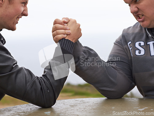 Image of Closeup, friends and competition with men and arm wrestling in nature for challenge, power and respect. Team, strong and conflict with hands of people and holding hands for muscle, match and rival