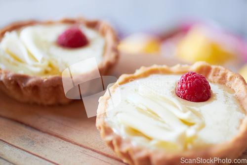 Image of Cream tart closeup, dessert and bakery with cake and sweet treat on wooden table. Pastry, catering and hospitality industry with food, baked goods and custard confectionery, rich snack and fresh bake