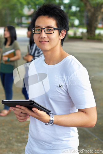 Image of Asian man, college student and tablet in outdoor portrait with smile for study, education and social media app. Japanese gen z person, digital touchscreen and learning at university, campus or school