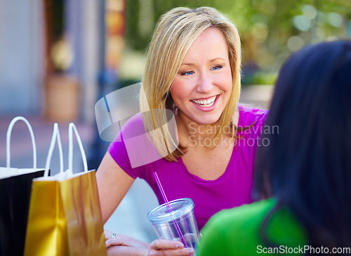 Image of Shopping, restaurant and woman or friends for social conversation, holiday sale and wealth in city or outdoor. Happy people or customer talking of retail, gift bag and together at cafe or coffee shop