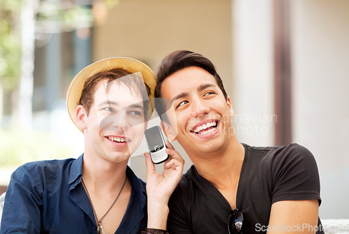 Image of Happy, phone call and friends listening to a message, communication or audio conversation. Thinking, smile and men with a mobile to listen to a person speaking on an app or funny joke in the city