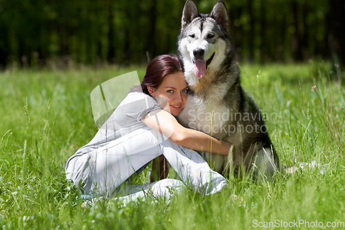 Image of Woman, husky and smile in portrait, field or park with hug, love and bonding with care in summer sunshine. Girl, pet dog and happy in nature, woods or grass with embrace on adventure in countryside