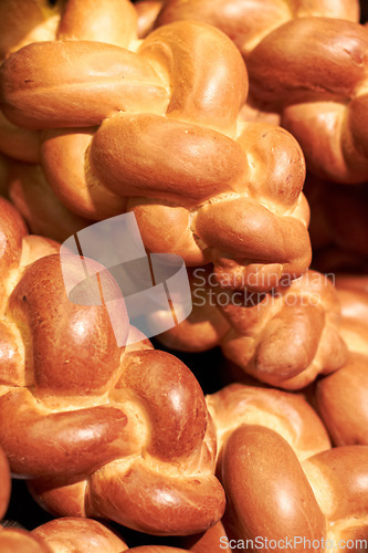 Image of Above, bakery and closeup of fresh bread for breakfast, lunch or dinner. Diet, healthy and baked food, baguette rolls and buns in the kitchen for a homemade snack or carbs from a cafe or restaurant