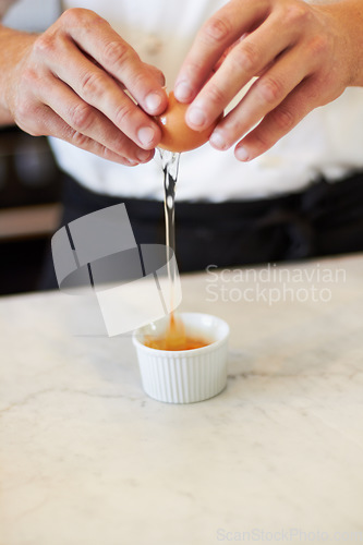 Image of Baking, crack egg and hands with breakfast in the kitchen for health, protein and nutrition closeup. Bakery, morning and chef or person with creme brulee or food for dinner diet or restaurant cooking