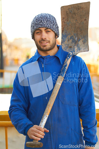 Image of Portrait, shovel and a man construction worker on a building site for manual labor on a development project. Industrial, builder and maintenance with a professional engineer or contractor outdoor