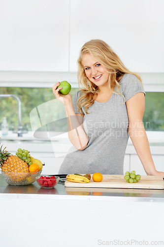 Image of Fruits, apple or portrait of happy girl for healthy lunch or breakfast meal or diet in kitchen at home. Morning snack, smile or vegan woman eating fresh food to lose weight for wellness or gut health