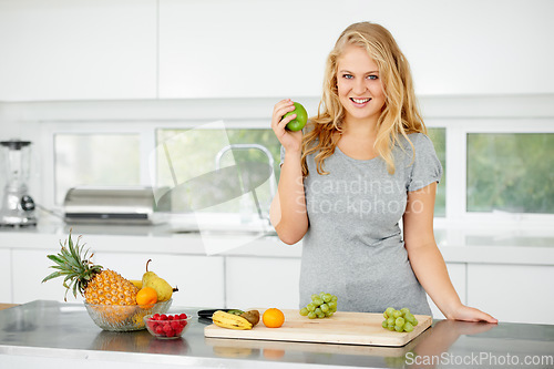 Image of Fruits, apple or portrait of happy woman for healthy lunch or breakfast meal or diet in kitchen at home. Morning snack, smile or vegan girl eating fresh food to lose weight for wellness or gut health