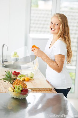 Image of Woman portrait, eating orange and fruit for plus size health and nutrition for weight loss diet and healthy at home. Kitchen, fruits and food in a house with breakfast and nutritionist in the morning