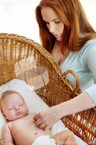 Image of Woman, baby sleeping and home bedroom with morning nap, tired yawn and parent love in nursery. Newborn, mother and mama care with young child with mom in a house with childcare in bed with support