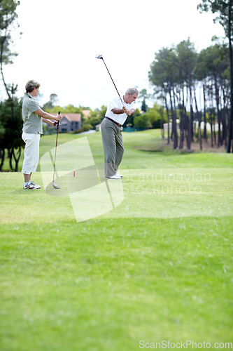 Image of Old couple, sports or golfer playing golf for fitness, workout or exercise to swing on course or field. Senior woman, elderly man golfing or training in practice game to strike a ball in retirement