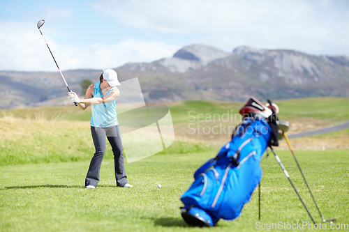 Image of Driver, woman or golfer playing golf for fitness, workout or exercise with a swing on a green course. Wellness, girl golfing or athlete training in action or sports game driving with a club stroke