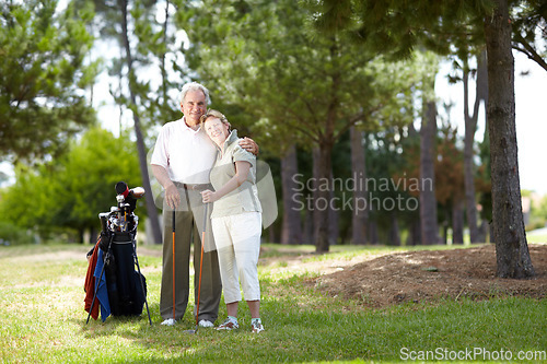 Image of Portrait, smile or happy old couple on golf course in fitness workout, exercise or round together on grass. Embrace, healthy elderly man hugging or smiling in golfing sports game with senior woman