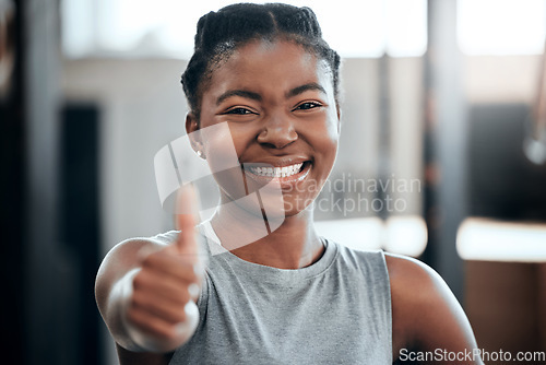 Image of Fitness, portrait or happy black woman with thumbs up in gym training with positive mindset or motivation. Wellness, smile or healthy personal trainer in workout with a like hand gesture for support