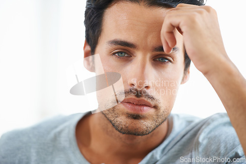 Image of Serious man, closeup and face of handsome model or resting hand on head on isolated and white background. Portrait of Spanish male person, clean skin or facial aesthetic with confidence and blue eyes