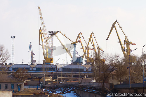 Image of Harbor, port and crane for shipping, outdoor and buildings for industry, manufacturing and supply chain. Urban shipyard, machine and equipment for trade, export and infrastructure for distribution