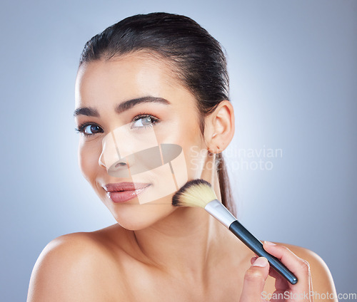 Image of Makeup, brush and asian woman portrait in studio with cheek tool, cosmetics or application on grey background. Face, shade and lady wellness model with beauty, glamour or contour, results or cover