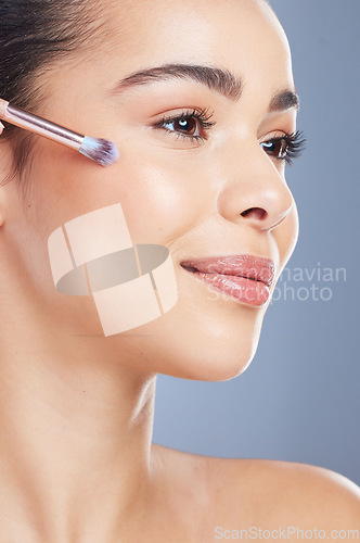 Image of Cosmetic, profile and woman with makeup brush for natural, glamour and facial routine in studio. Self care, beauty and young female model from Brazil with cosmetology face isolated by gray background