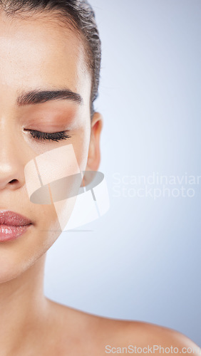 Image of Makeup, half and face of woman in studio for cosmetics, glamour and treatment on grey background. Beauty, wellness and asian female skin model with eyeshadow, foundation and luxury glow satisfaction