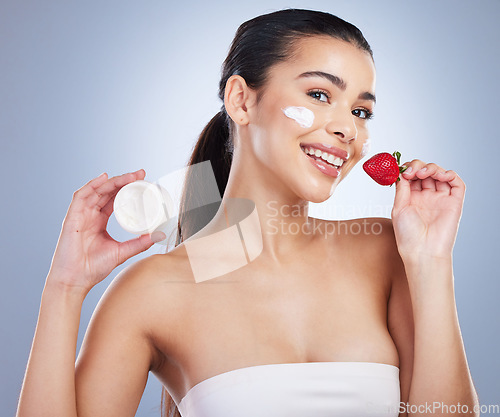 Image of Beauty, face cream and portrait of woman with strawberry in studio for natural, health or wellness routine. Skincare, self care and female model with fruit for facial treatment by a gray background.