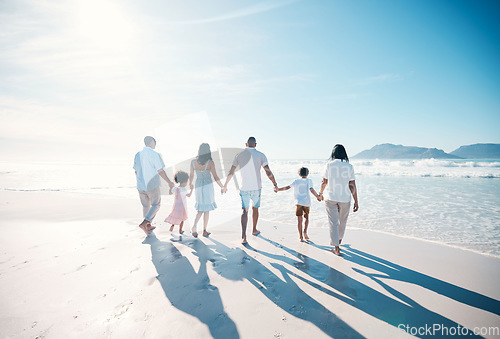 Image of Travel, beach and big family walking on vacation together at the sea or ocean bonding for love and happiness. Happy, sun and parents with children or kids and grandparents on holiday for freedom