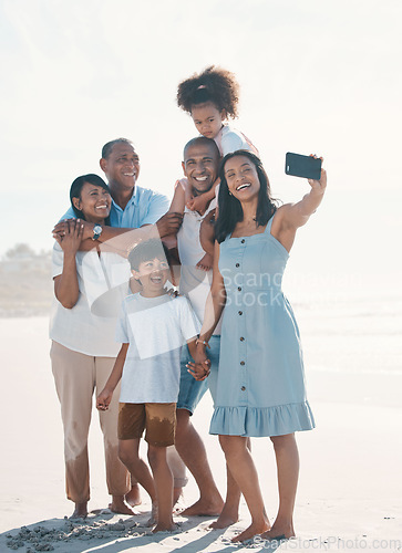 Image of Selfie, beach and portrait of happy family on social media together at the sea or ocean for love, care and happiness. Internet, online and parents with children or kids and grandparents on a holiday