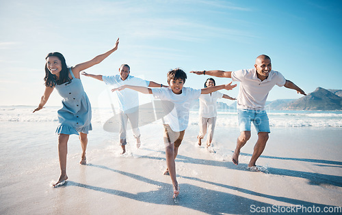 Image of Fly, beach and happy family running on vacation together at sea or ocean bonding for love, care and happiness. Summer, sun and parents with children or kids and grandparents on holiday for freedom