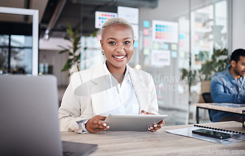 Image of Portrait of happy woman at desk in coworking space with tablet, laptop and work at design agency. Business, smile and African girl in office with online report in digital career at tech startup job.