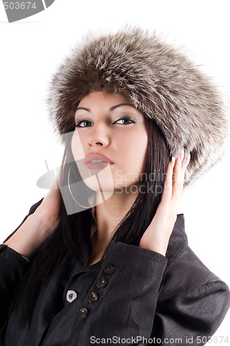 Image of Portrait of the young woman in a fur cap. Isolated