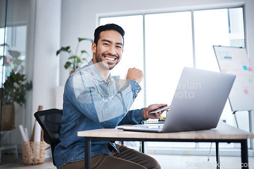 Image of Business man, laptop and smile in startup office, web design or planning with pride for entrepreneurship. Asian businessman, pc or happy content creator for coding, programming or website development