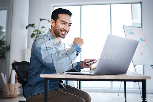 Image of Thinking, laptop and happy man at desk reading email, online report or research planning at design agency. Business, brainstorming and computer, employee in creative office with internet and smile.