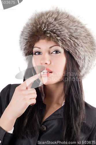 Image of Portrait of the young woman in a fur cap. Isolated on white
