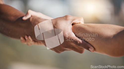 Image of People, holding hands and pull arm for teamwork, solidarity and trust for safety, training or exercise in nature. Team, support and helping for kindness, strong and care with fitness, workout or goal