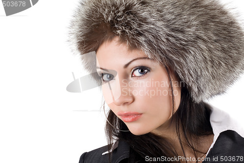 Image of Portrait of the young woman in a fur cap