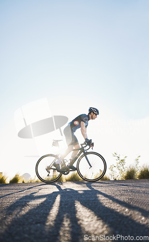 Image of Mountain, sports and male cyclist cycling on bicycle training for a race or marathon in nature. Fitness, workout and man athlete riding a bike for cardio exercise on an outdoor off road trail.