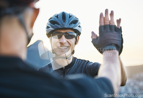 Image of Man friends, cycling and high five for teamwork, goal and success with winning, motivation and race in Cape Town. Cyclist team building, support and solidarity with smile, hands and happy for workout