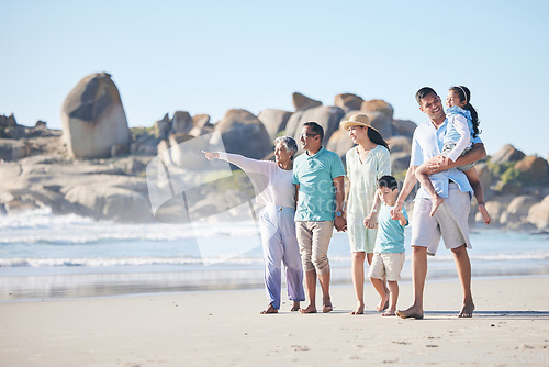 Image of Travel, beach and family and children walking by sea for bonding, quality time and relaxing in nature. Grandparents, travel and happy mom, dad and kids by ocean on holiday, vacation and adventure