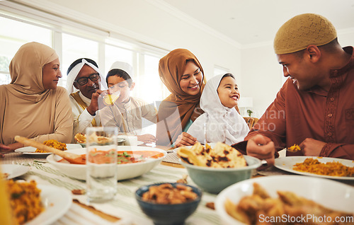 Image of Food, happy and muslim with big family at table for eid mubarak, Islamic celebration and lunch. Ramadan festival, culture and iftar with people eating at home for fasting, islam and religion holiday