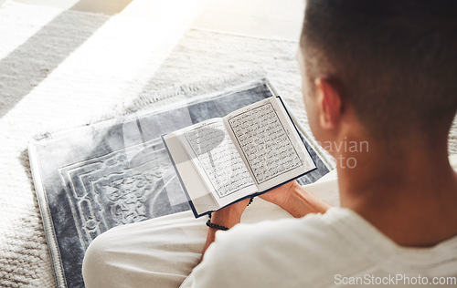 Image of Prayer, muslim and Quran with man on living room floor for eid mubarak, God and worship. Islamic, hope and Ramadan with spiritual person praying on mat at home for faith, religion and gratitude