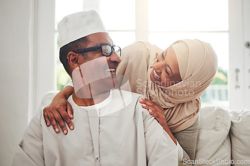 Image of Home portrait, Muslim and elderly couple laughing at funny conversation, humour and care in retirement, bonding or marriage. Happiness, Love or Islamic man, woman and senior people laughing at comedy