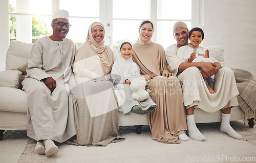 Image of Portrait, Islam and big family on sofa for Eid with parents, grandparents and kids in home culture in Indonesia. Muslim men, women in hijab and happy children, generations on couch together in lounge