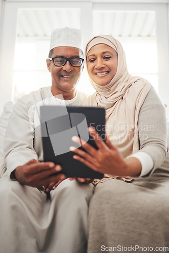 Image of Tablet video call, Muslim and happy elderly couple talking, speaking and on online communication. Global networking, Islam home and Arab man, woman or senior people consulting on virtual conversation